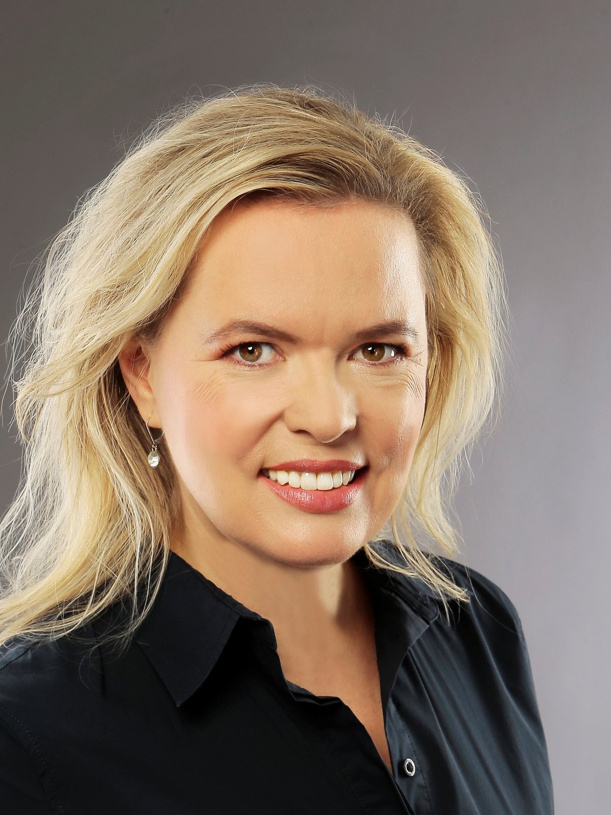Adriana Jahňáková, founder of AJ Vision Lab — studio portrait.